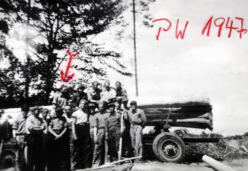 Historical black and white photograph of workers with logging truck, 1947